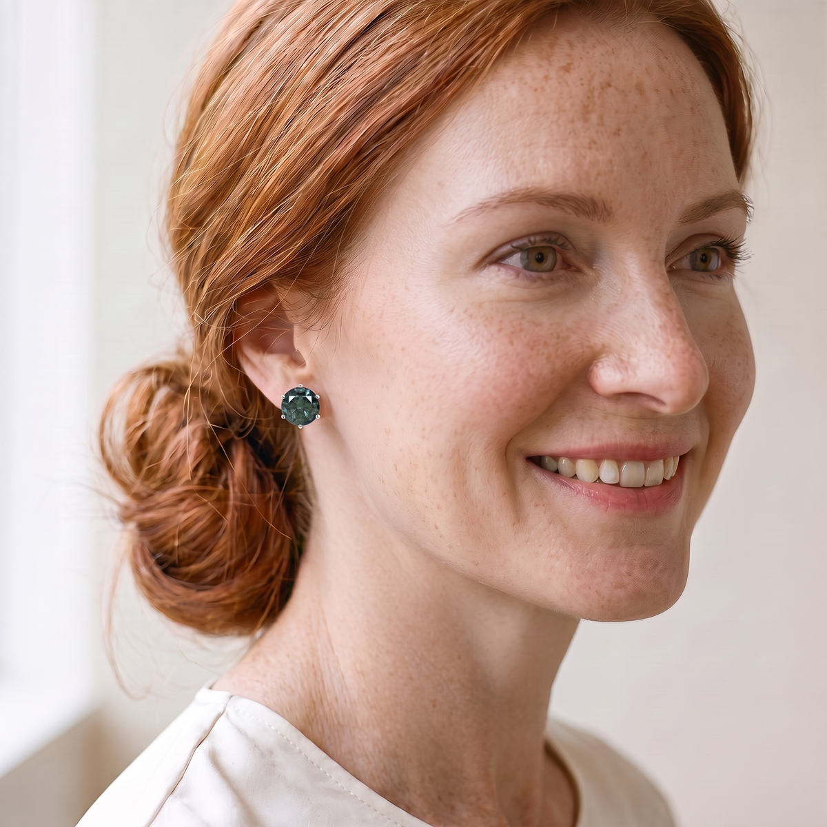 Absinthe Green Moissanite Solitaire Studs, worn by a woman