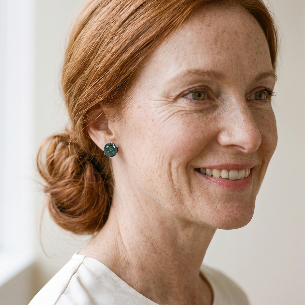 Absinthe Green Moissanite Solitaire Studs, worn by a woman
