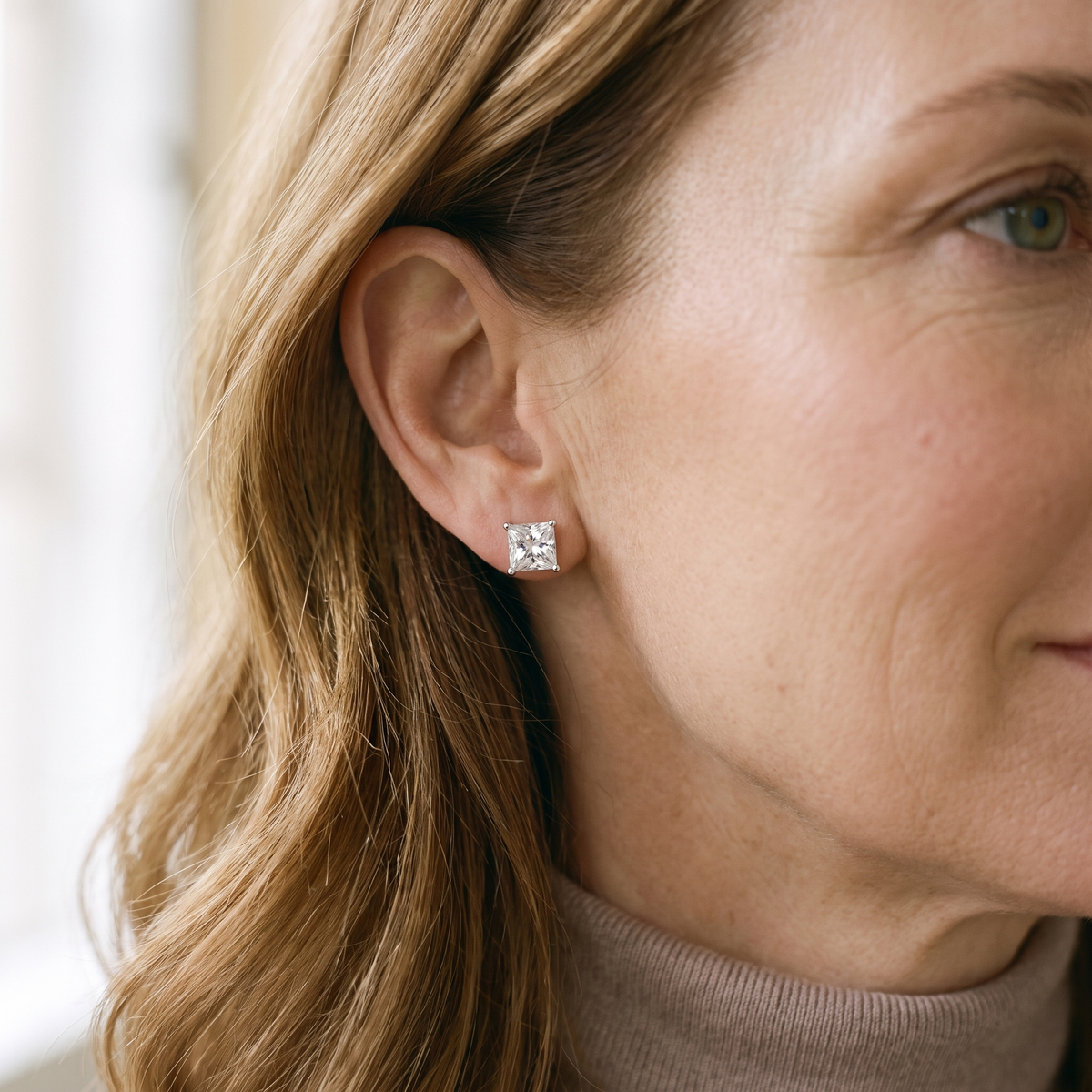 Carré Princess-Cut Moissanite Studs, worn by a woman