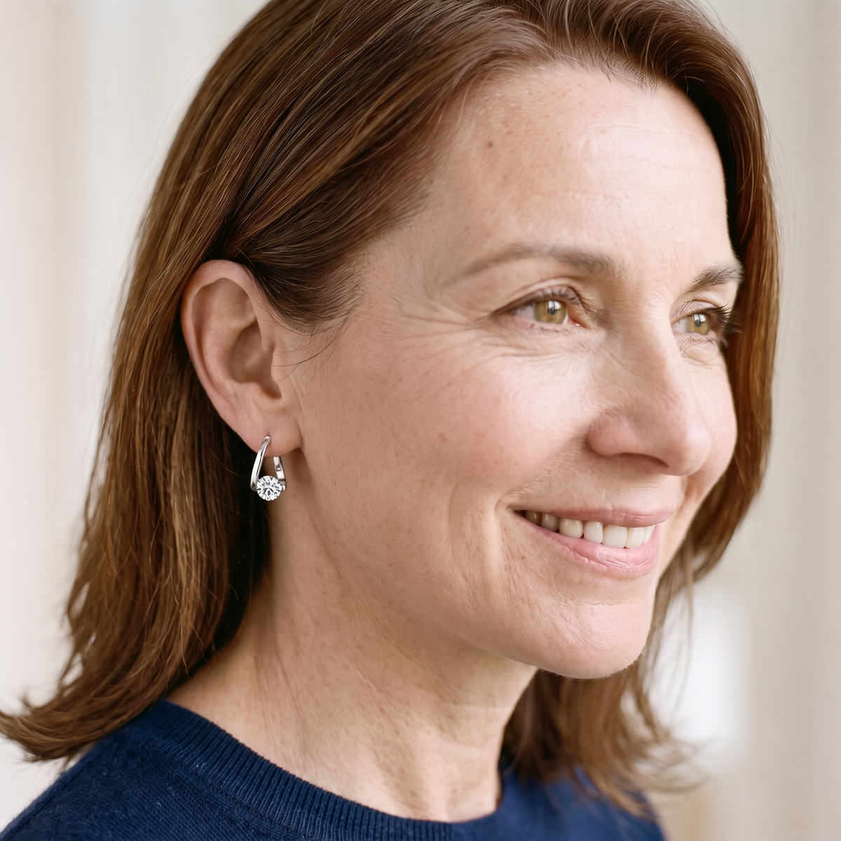 Croisette Moissanite Crossover Hoops, worn by a woman