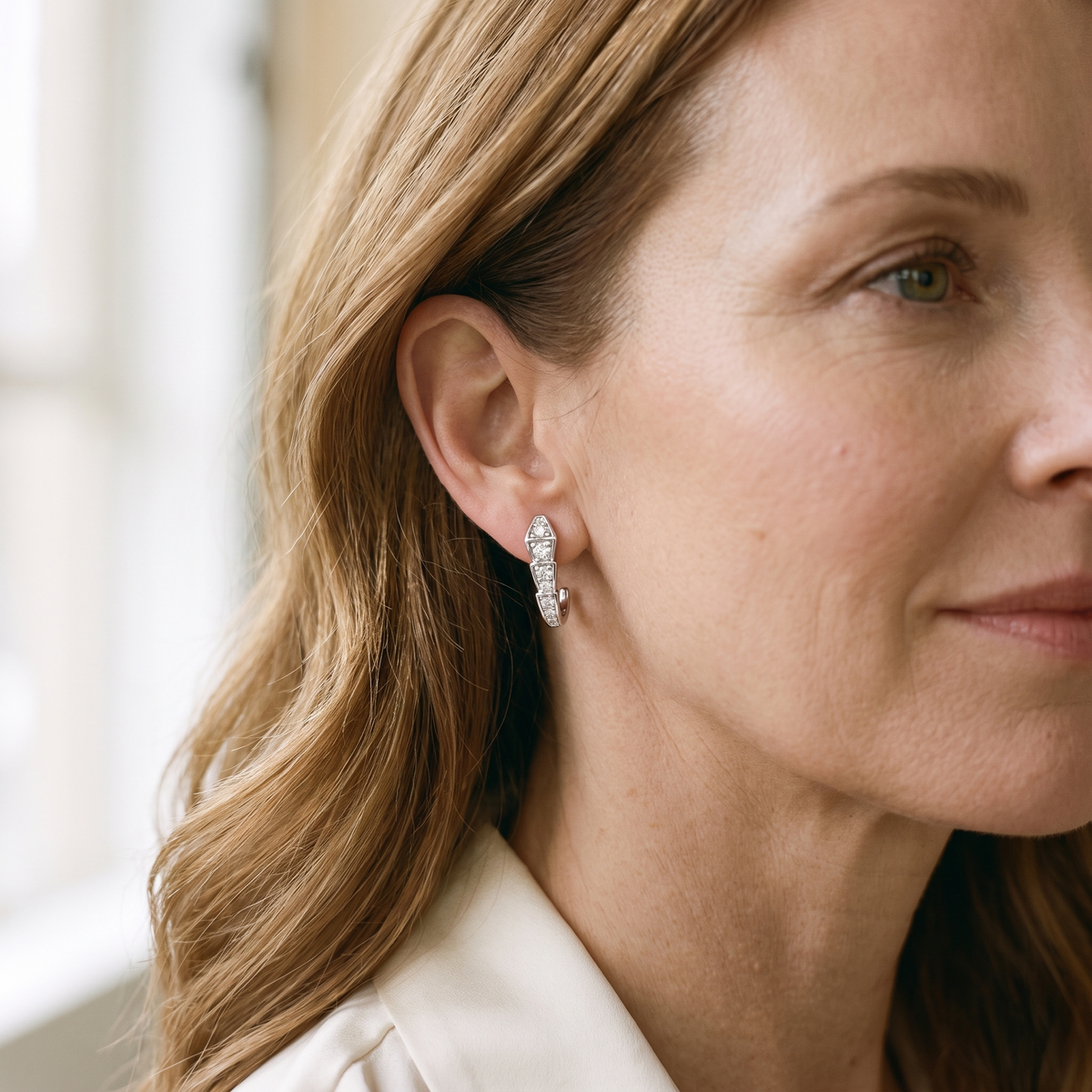 Ève Moissanite Geometric Snake Studs, worn by a woman