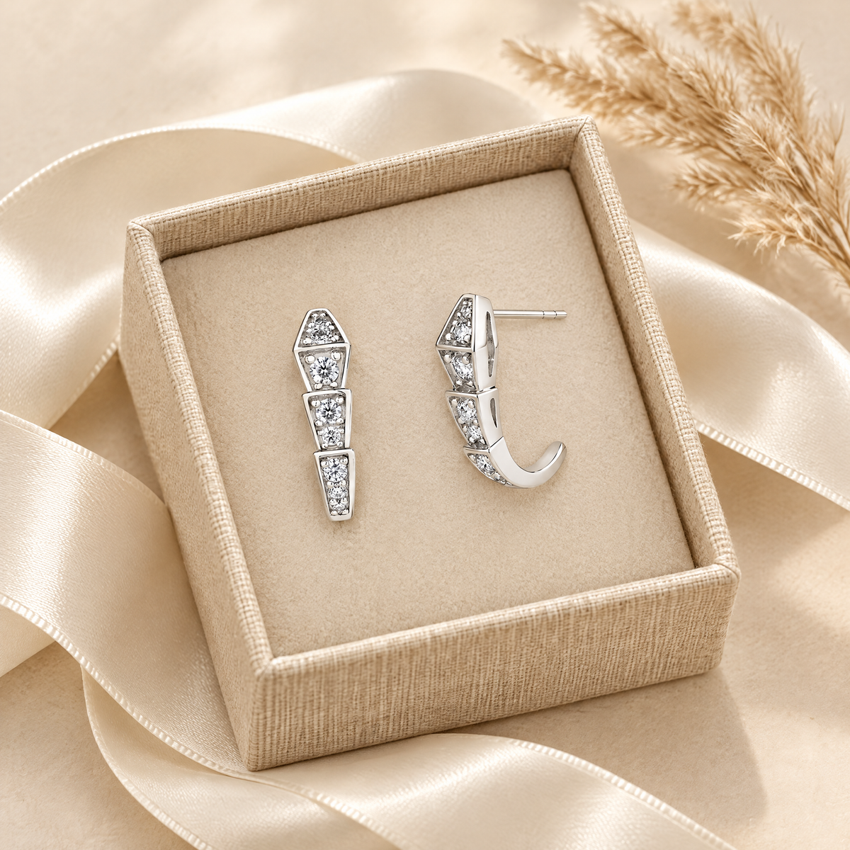 Ève Moissanite Geometric Snake Studs, presented in a box
