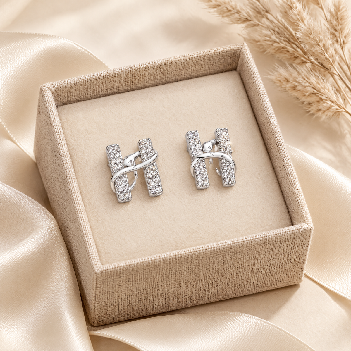 Hermine Moissanite H Snake Studs, presented in a box