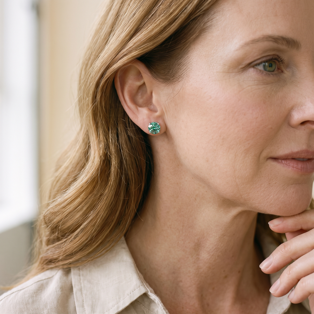 Iris Colored Moissanite Solitaire Studs, worn by a woman
