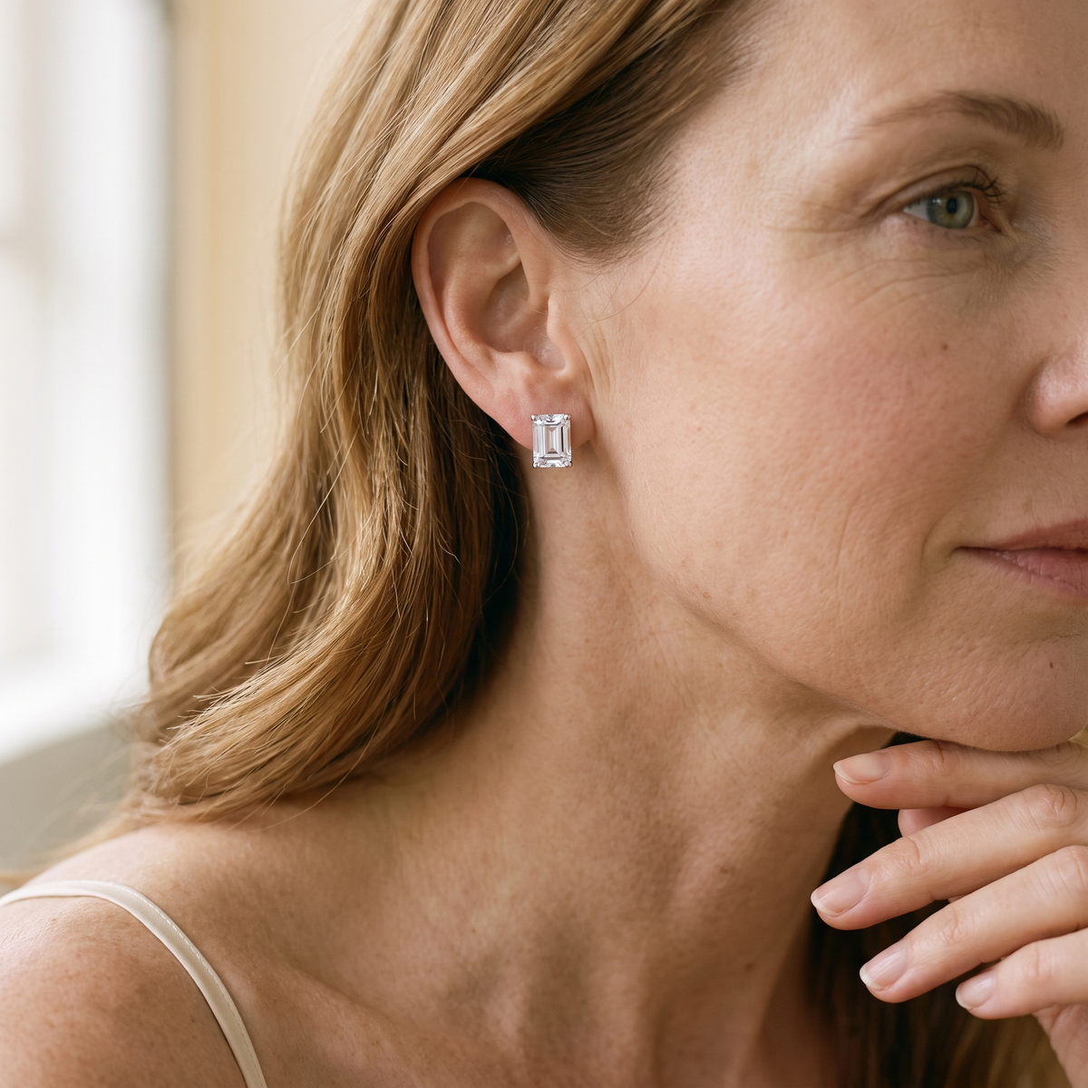 Joséphine Emerald-Cut Moissanite Studs, worn by a woman