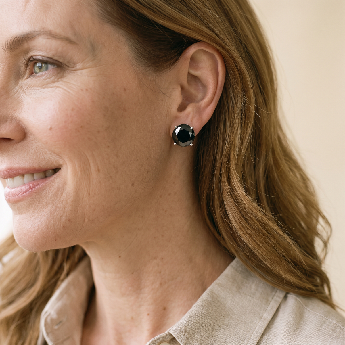 Minuit Black Moissanite Solitaire Studs, worn by a woman
