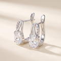 Olympe Oval Moissanite Huggies in White Gold