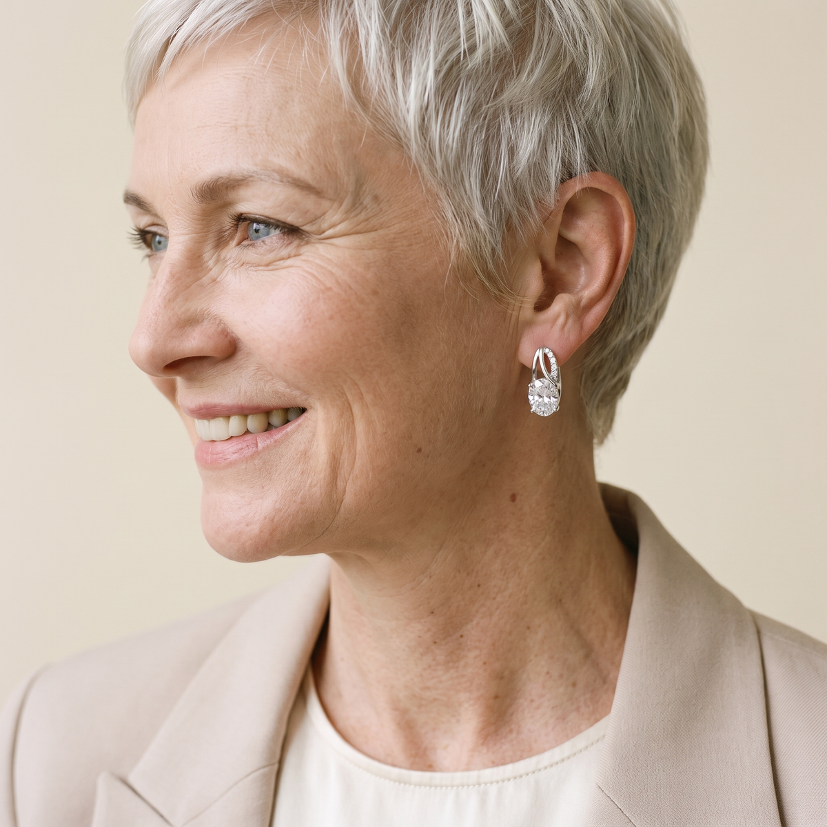 Olympe Oval Moissanite Huggies, worn by a woman