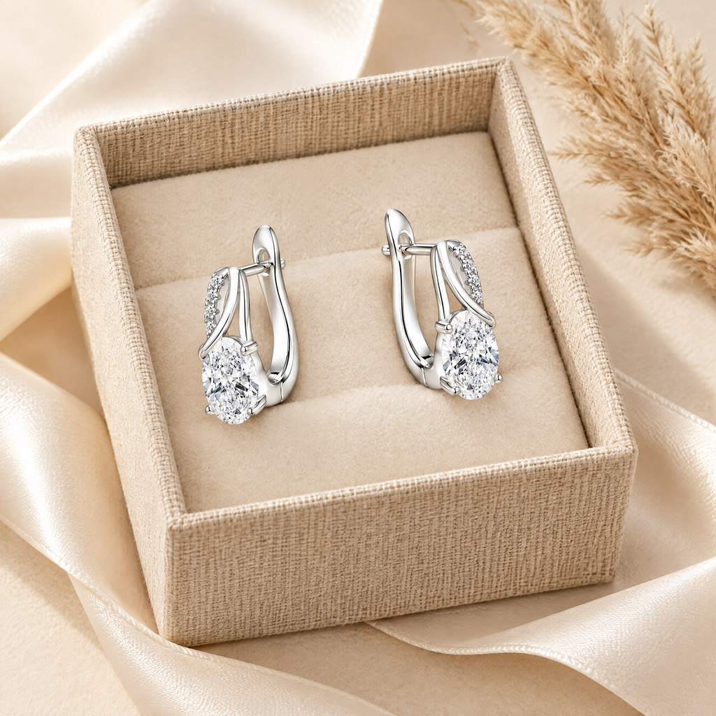 Olympe Oval Moissanite Huggies, presented in a box