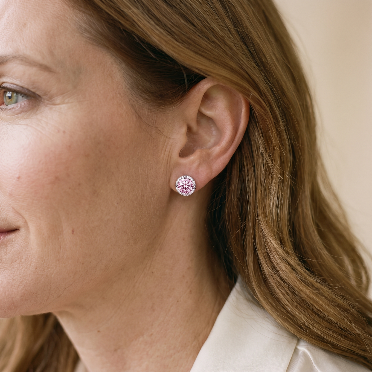 Opaline Colored Moissanite Halo Studs, worn by a woman