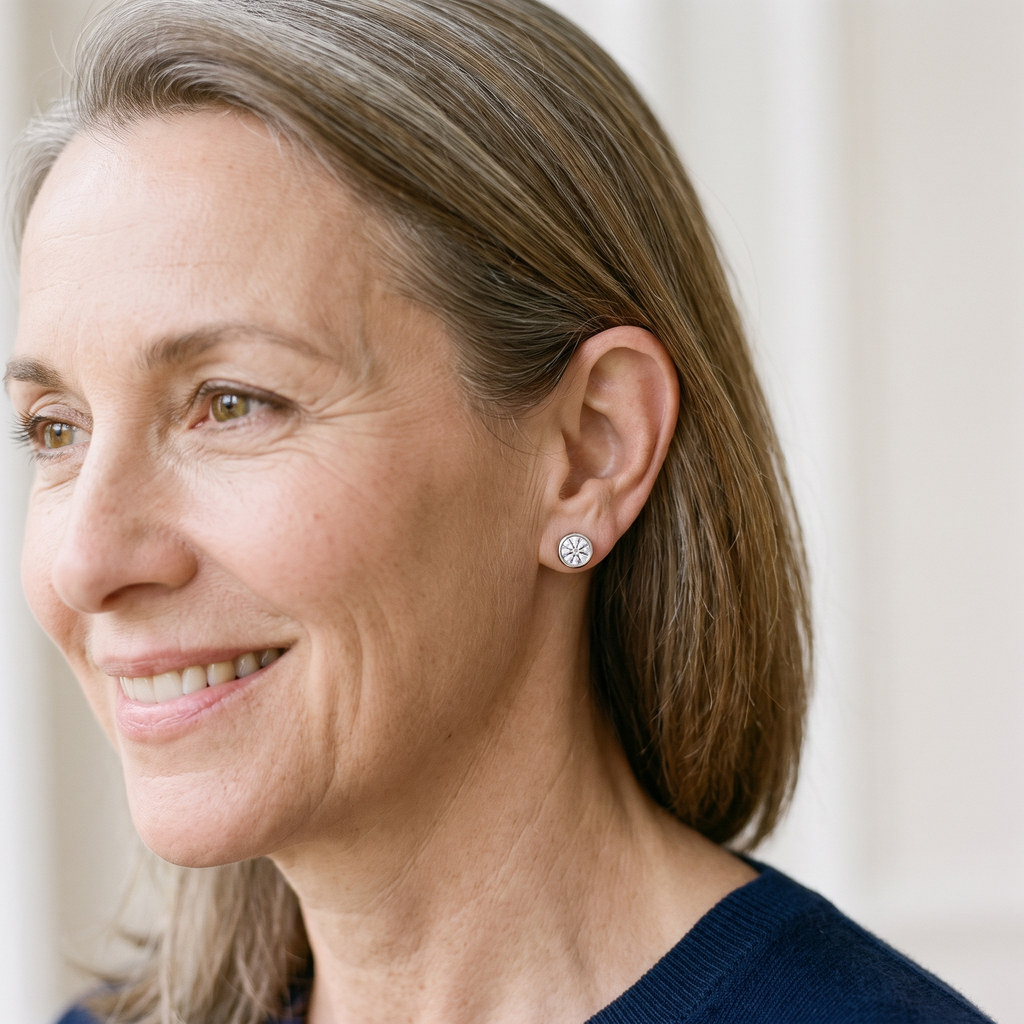 Orbe Bezel Moissanite Studs, worn by a woman