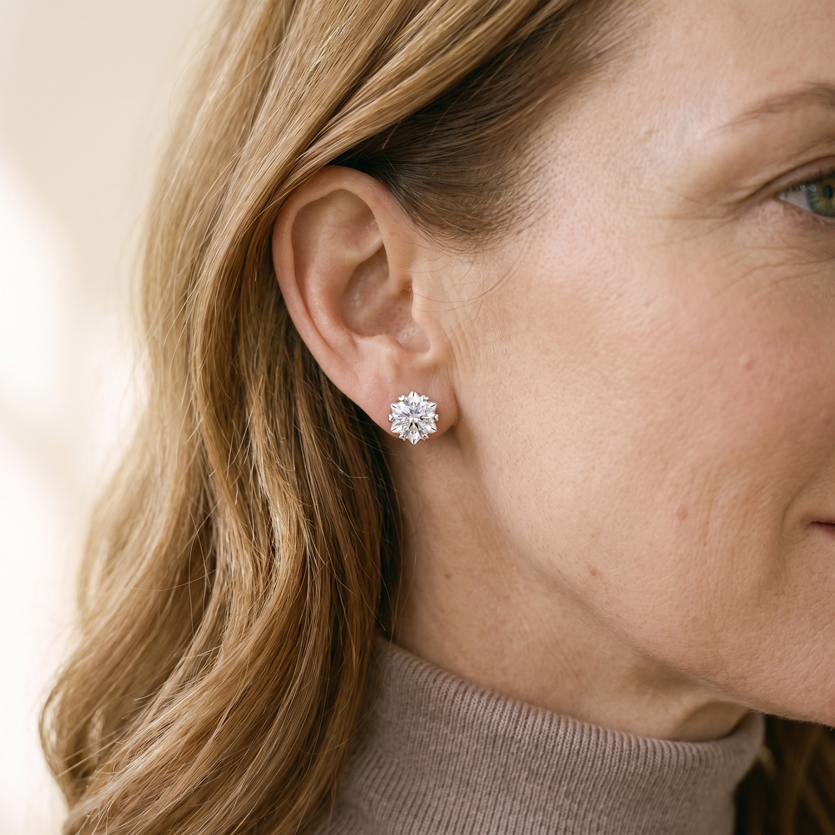 Pâquerette Moissanite Heart-Prong Studs, worn by a woman
