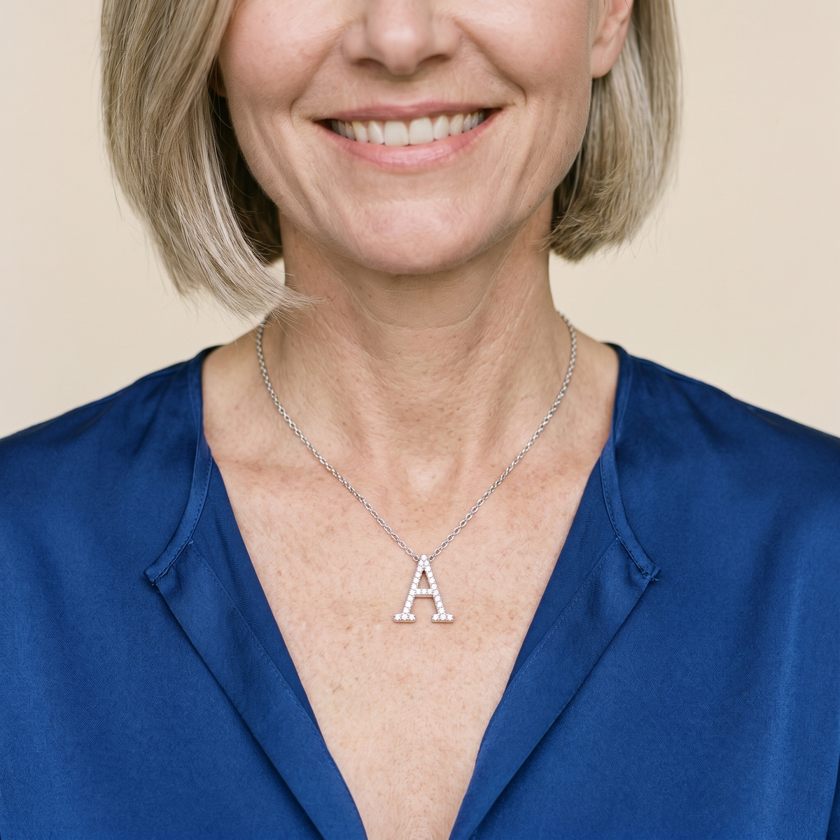 Signature Moissanite Pavé Initial Necklace, worn by a woman