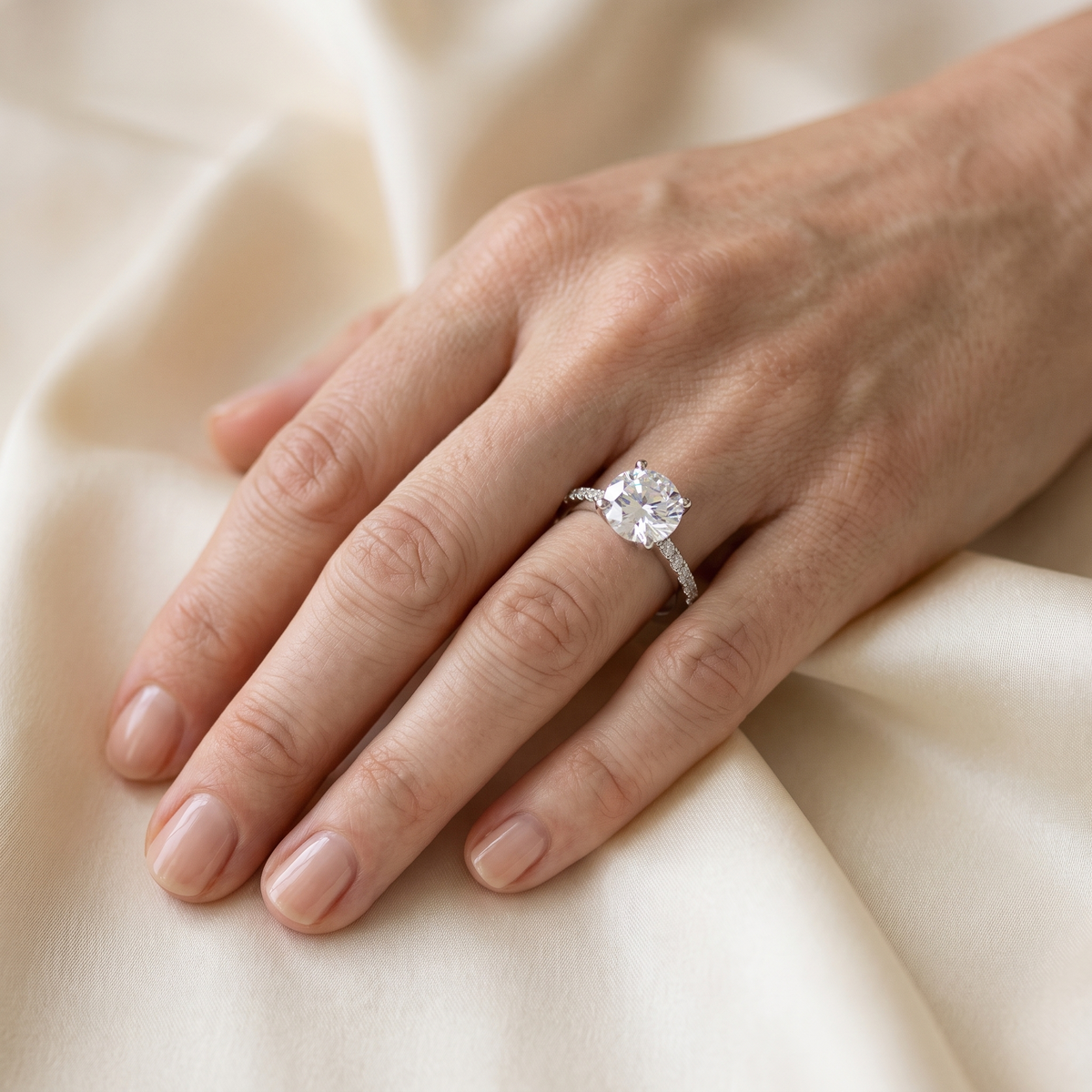 Stella Pavé Moissanite Solitaire Ring, worn by a woman