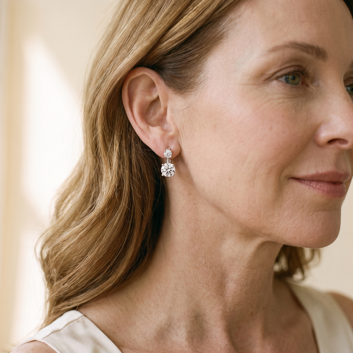 Toi et Moi Moissanite Huggies, worn by a woman