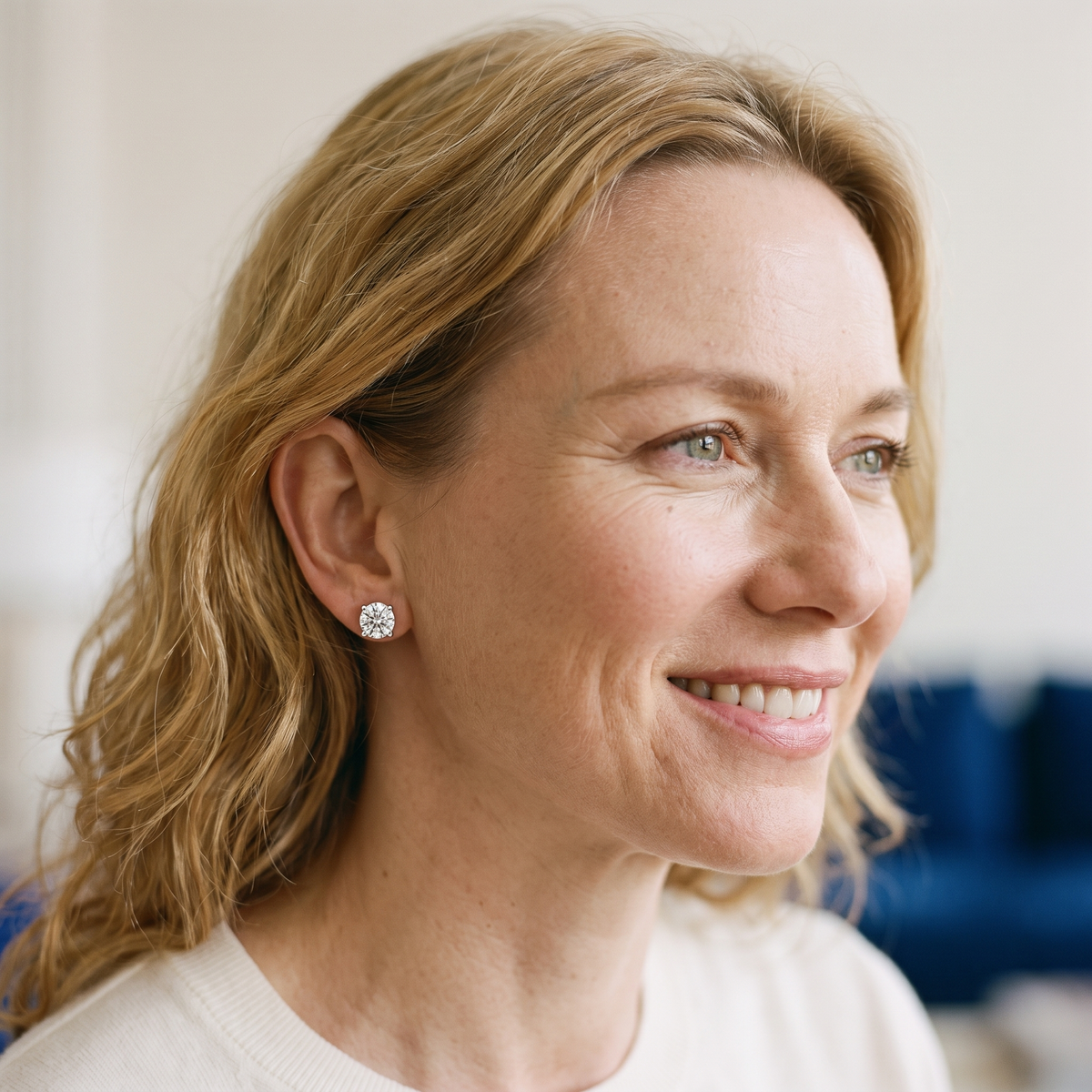 Véga Moissanite Solitaire Studs, worn by a woman